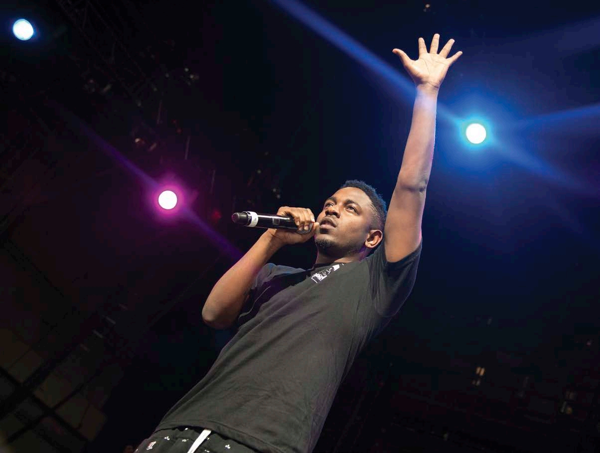 Lamar waves to the audience in Cincinnati Ohio during the 2012 Under the - photo 8