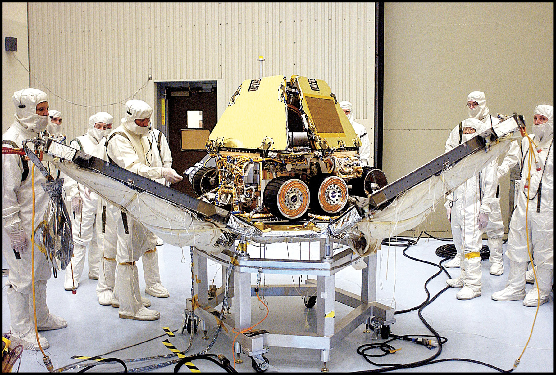 NASA technicians work on the landing gear of a Mars rover Scientists on Earth - photo 7