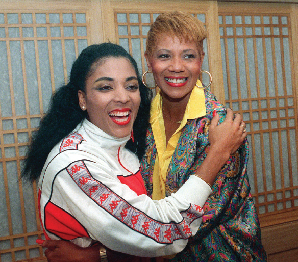 Image Credit AP Rudolph right hugs Florence Griffith Joyner another - photo 9