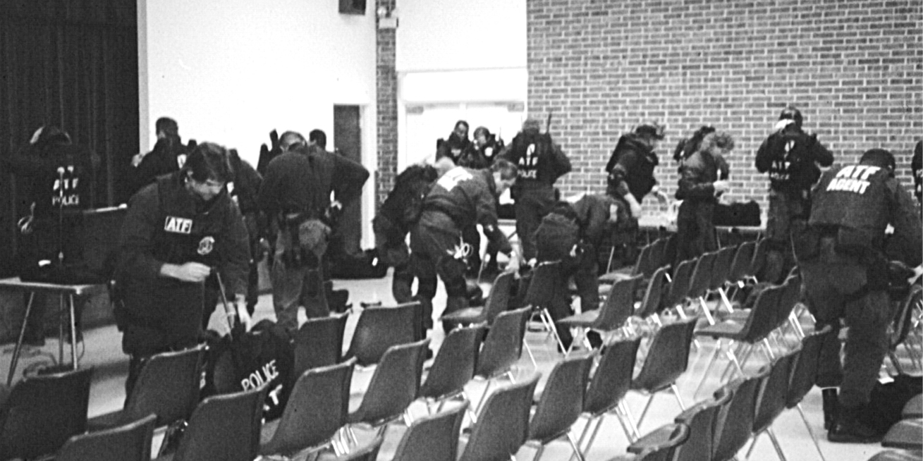 ATF agents in the Bellmead Civic Center staging area scramble to grab their - photo 10