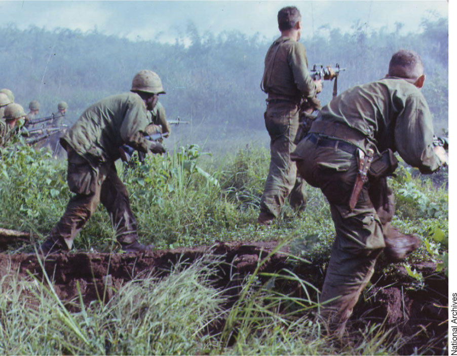 US Army soldiers prepare to assault a North Vietnamese position during - photo 14