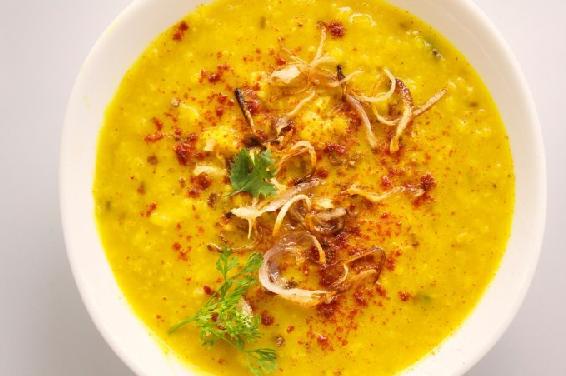 A garnish of tempered spices decorates this bowl of lentils and adds aroma and - photo 3