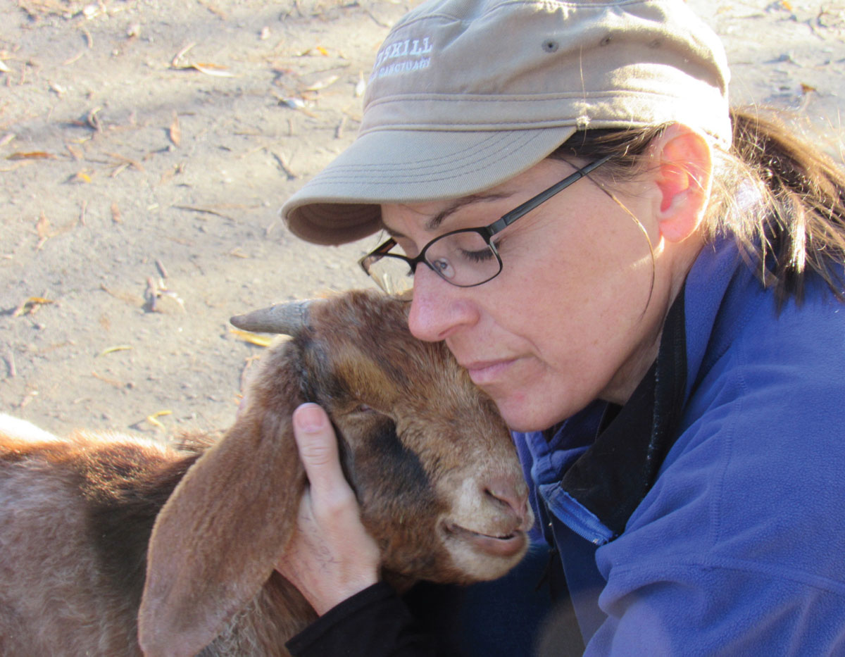 Kelly Mullins Animal Care Director and rescued goat Leo who was blind and - photo 4