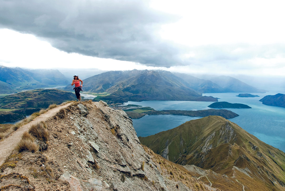 Runner along ridge near the summit of Roys Peak Wanaka SCOTT DARSNEY - photo 4