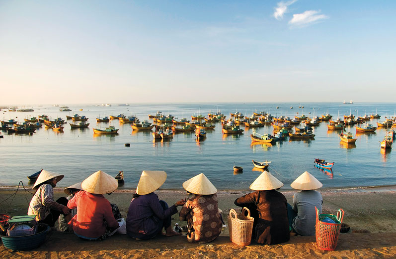 Women sitting by the beach near moored fishing boats Mui Ne MICAH WRIGHT - photo 4