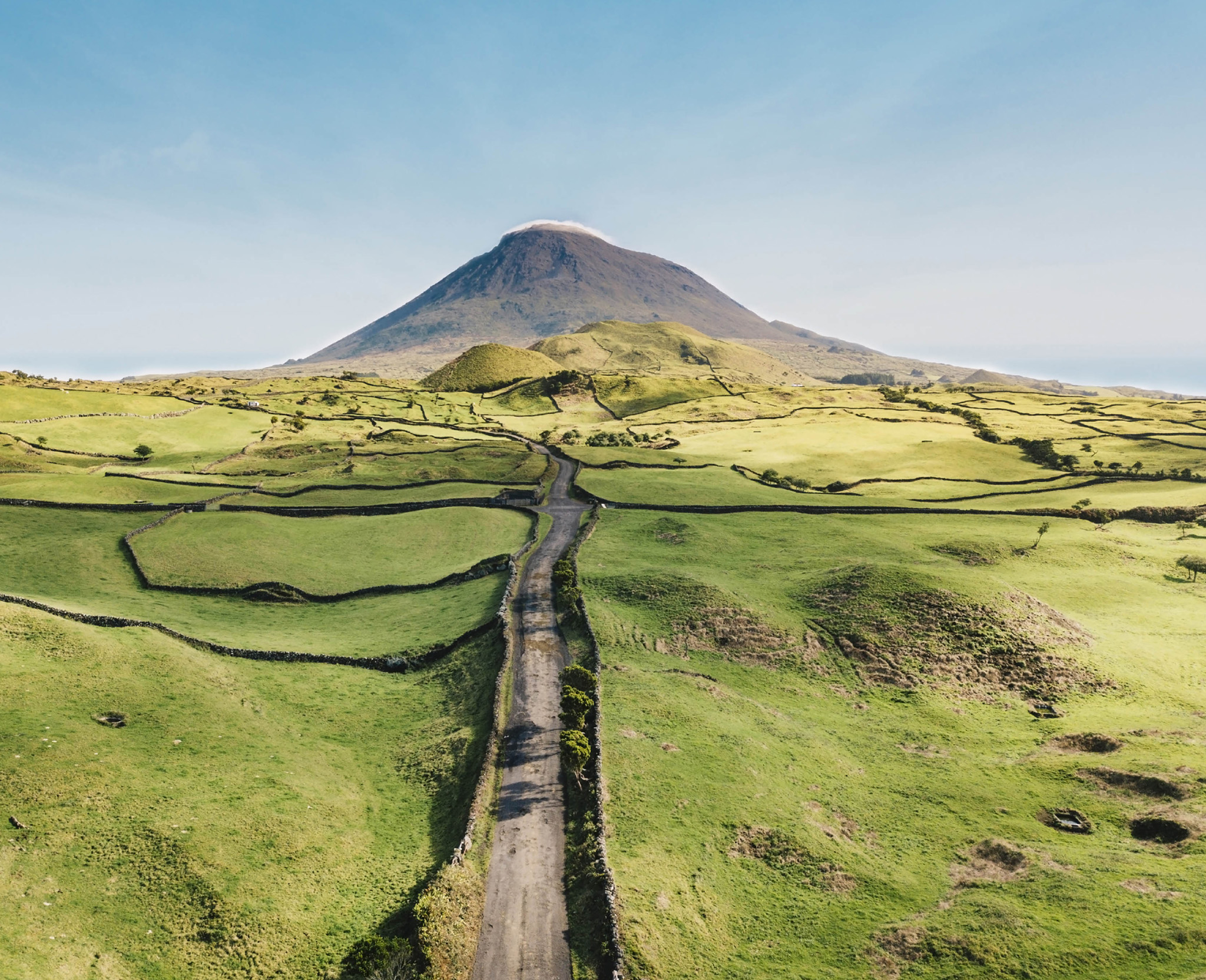 An empty road winding towards Mount Pico in the Azores Hiking through the - photo 3