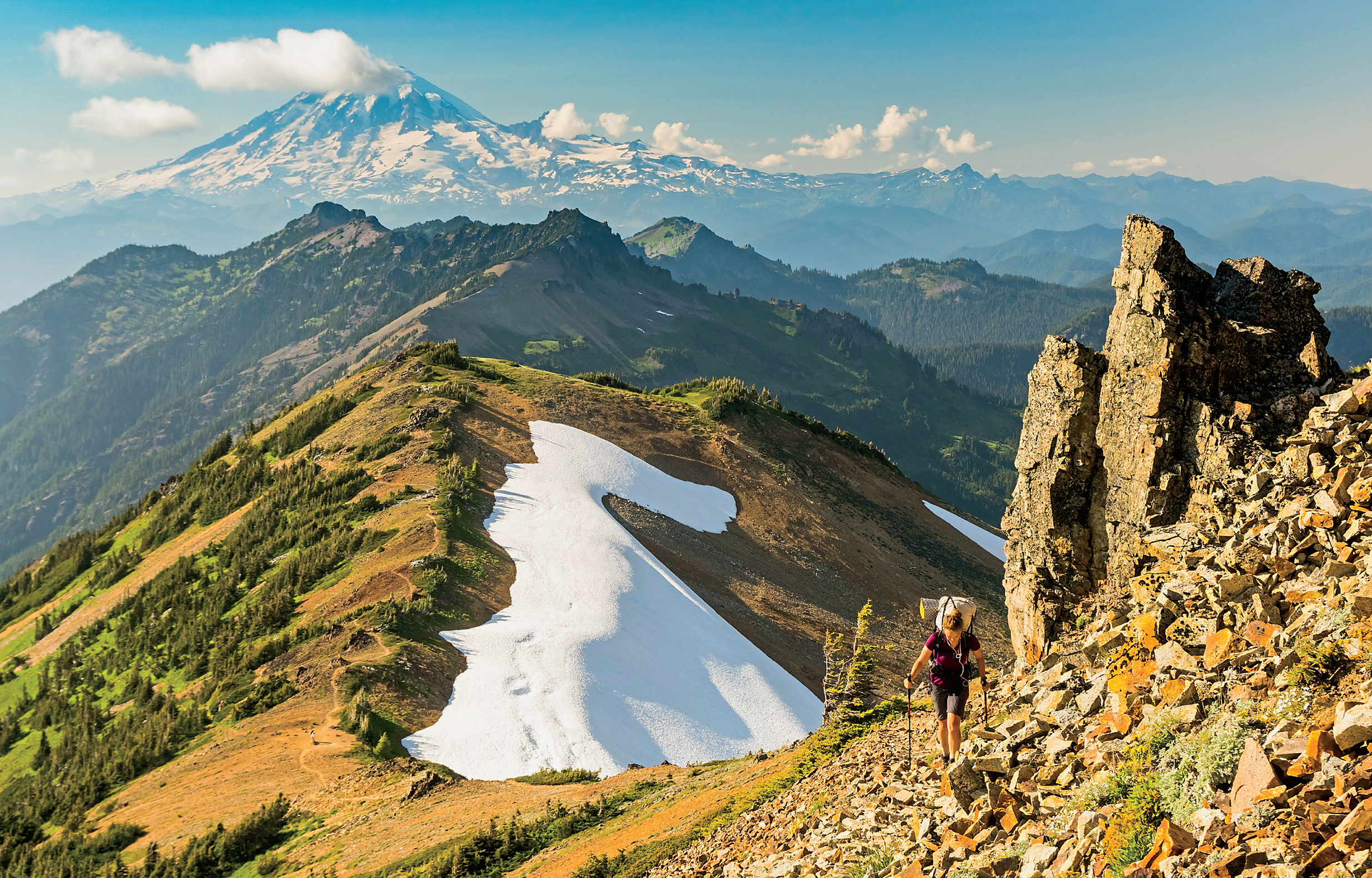 Southbound hikers are graced with snowcapped views of towering Mount Rainier as - photo 6