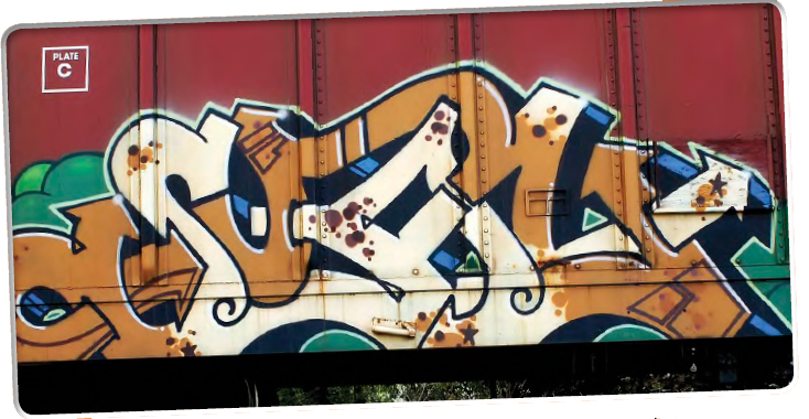 Graffiti artists have painted on trains in the image above and in the - photo 6