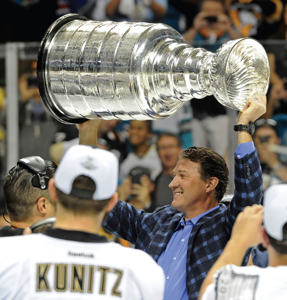 Penguins owner Mario Lemieux hoists the Stanley Cup after the Penguins defeated - photo 3