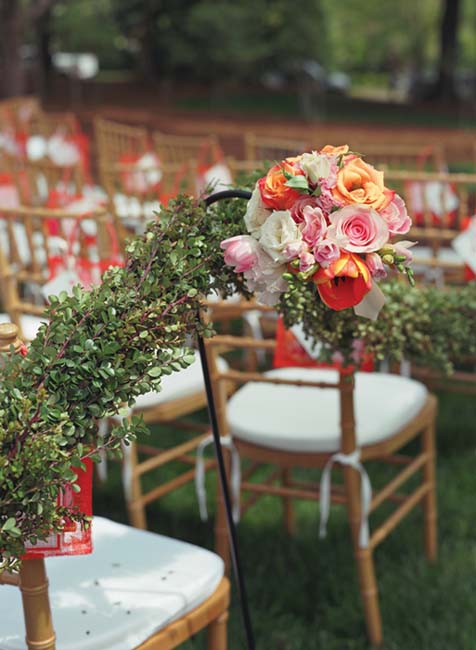 To help construct an aisle we used wrought-iron hooks boxwood garlands and - photo 11