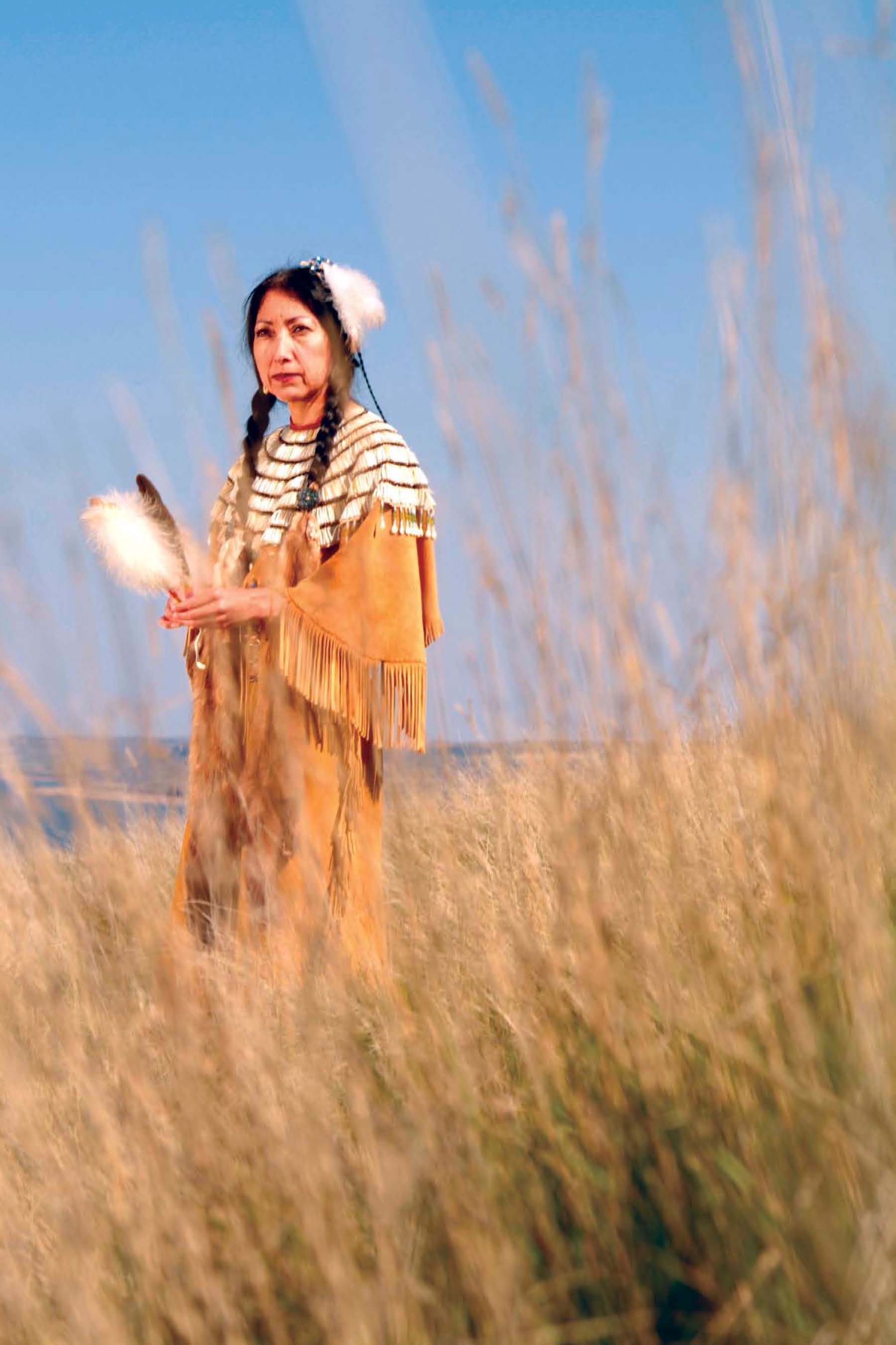 Amy Mossett a Mandan-Hidatsa woman is dressed in traditional clothing - photo 3