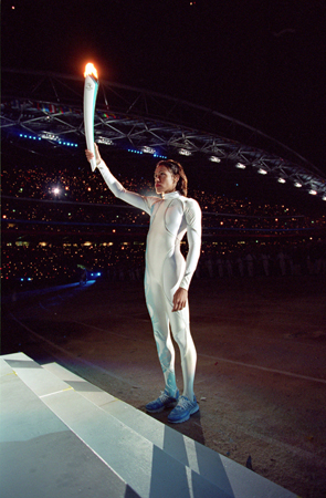 TORCHBEARER Australian track star Cathy Freeman stood before a home crowd as - photo 3