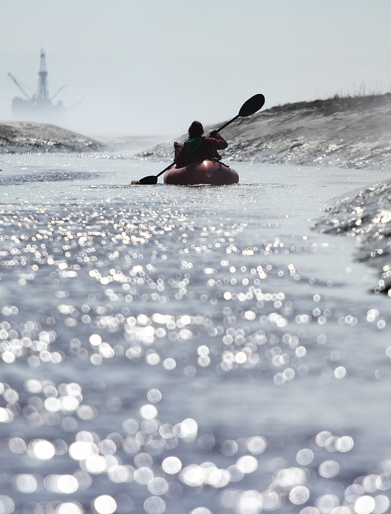 I paddle down a tidal channel of the Susitna River with an oil platform - photo 20