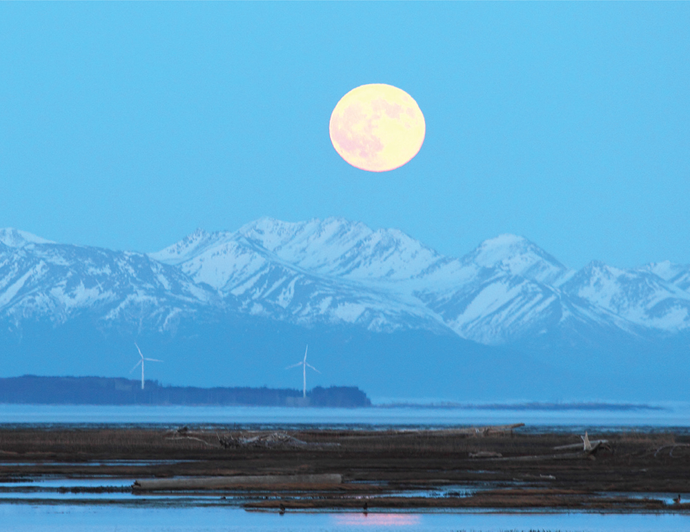 The full moon hangs over the Fire Island wind generators and the Chugach Range - photo 7