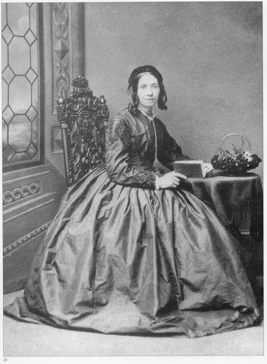 c186465 Although this womans hairstyle is indicative of an earlier era her - photo 20