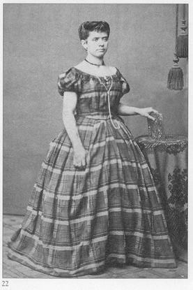 c186465 This womans dress is oddly ill-fitting It appears to have a fullness - photo 22