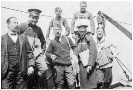 Ernest Hemingway second from left and other war personnel during a lifeboat - photo 12