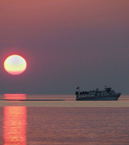 Apostle Islands Cruise Line boat at sunset The cruise line recently added a - photo 3