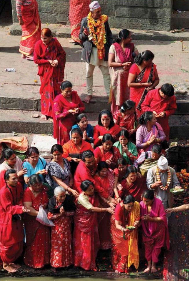 A gathering of people say good-bye to a loved one after cremation in Kathmandu - photo 7