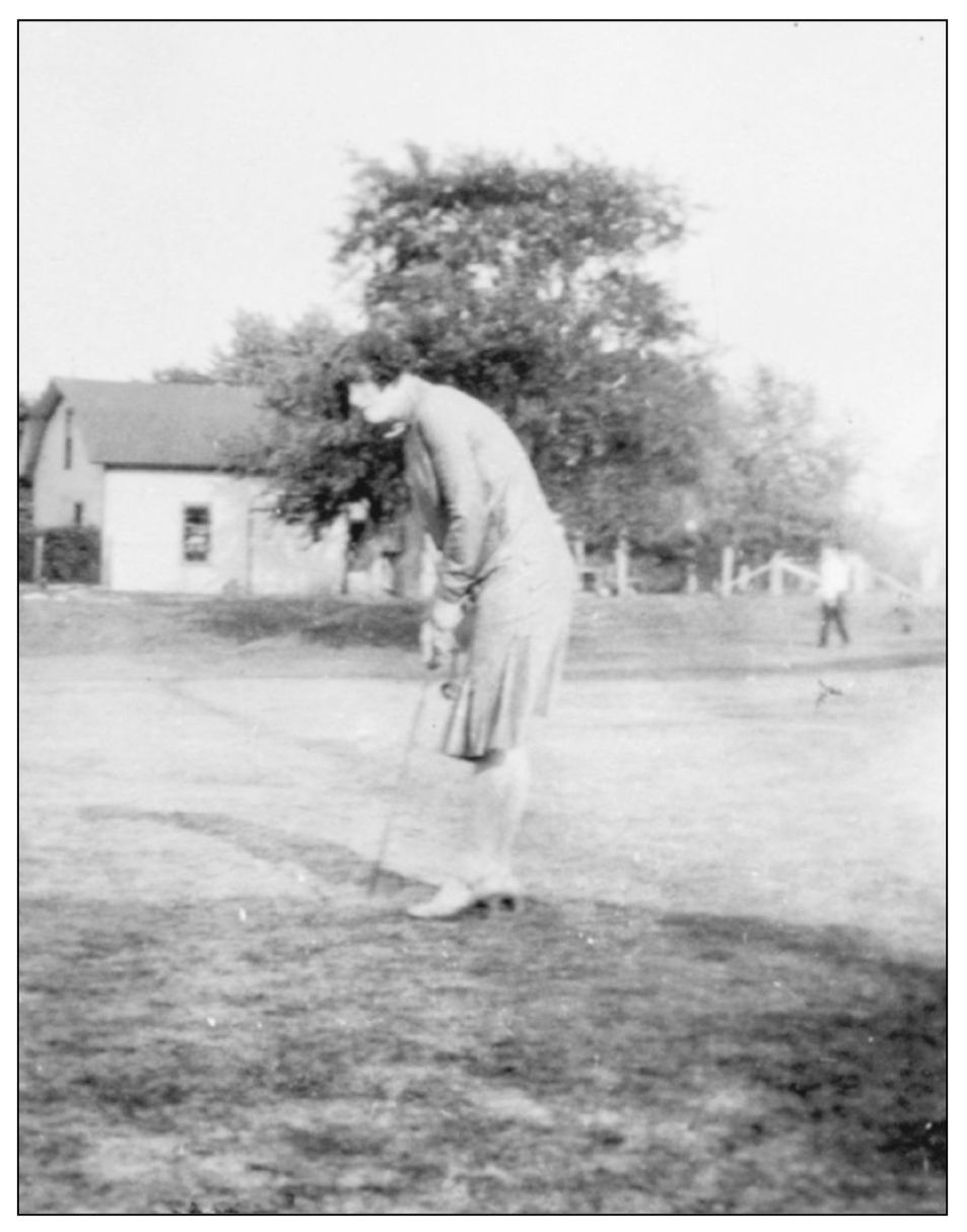 This unidentified Logan Square resident looks focused on her golf game Women - photo 8