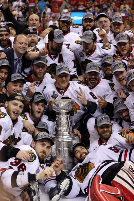 Chicago Blackhawks players celebrate their championship following Game 6 of the - photo 3