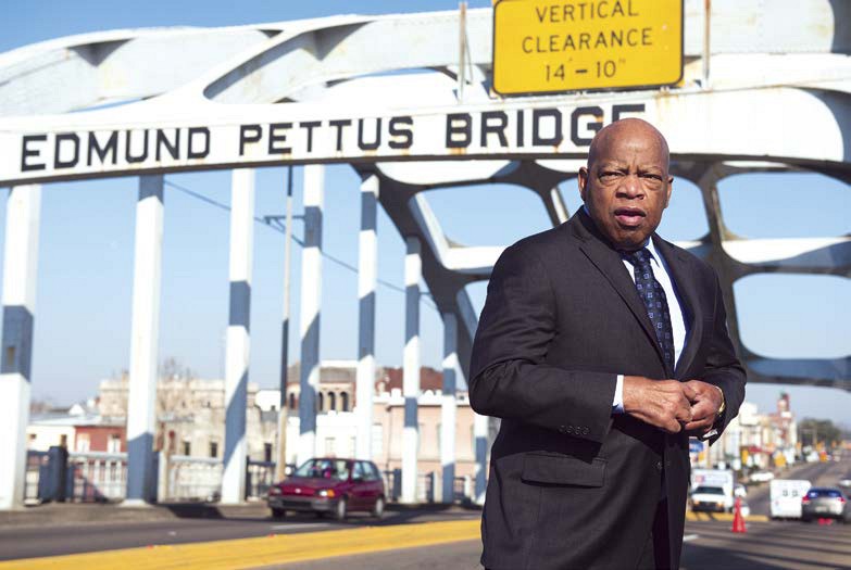 Congressman John Lewis stands on the Edmund Pettus Bridge in Selma Alabama - photo 3