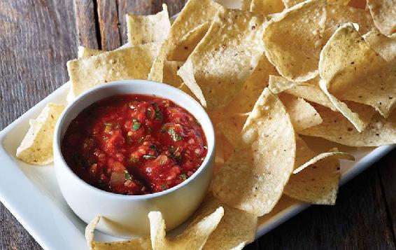 Potato chips and salsa are a common accompaniment thatRaj orders at the - photo 5