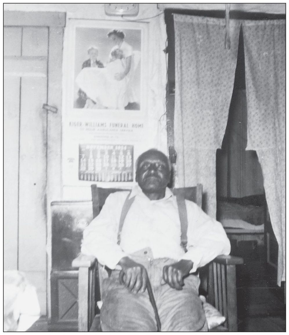 This September 1954 photograph shows John Henry Younger relaxing in a chair - photo 13