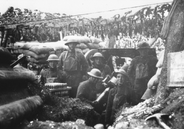 American artillery crew in a casemate crowded around their French 75mm field - photo 4