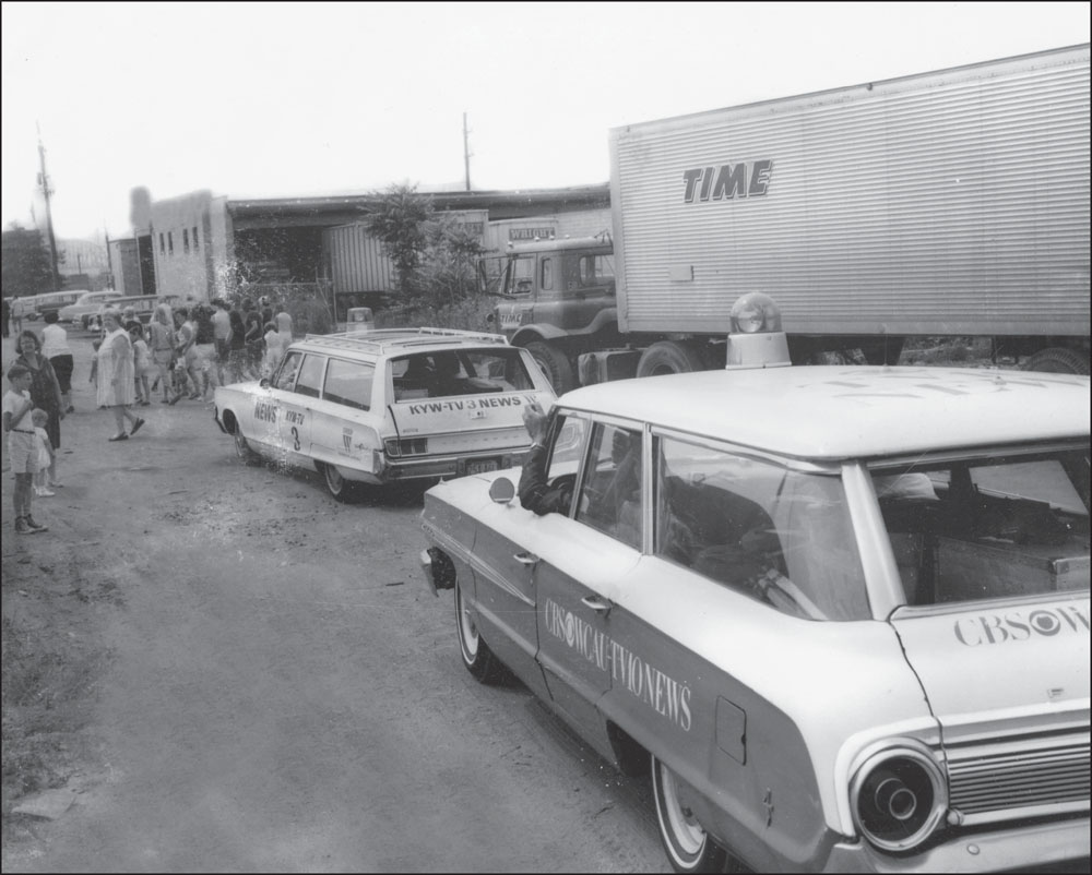 The WCAU and KYW station wagons are shown on the scene of a news story in July - photo 2