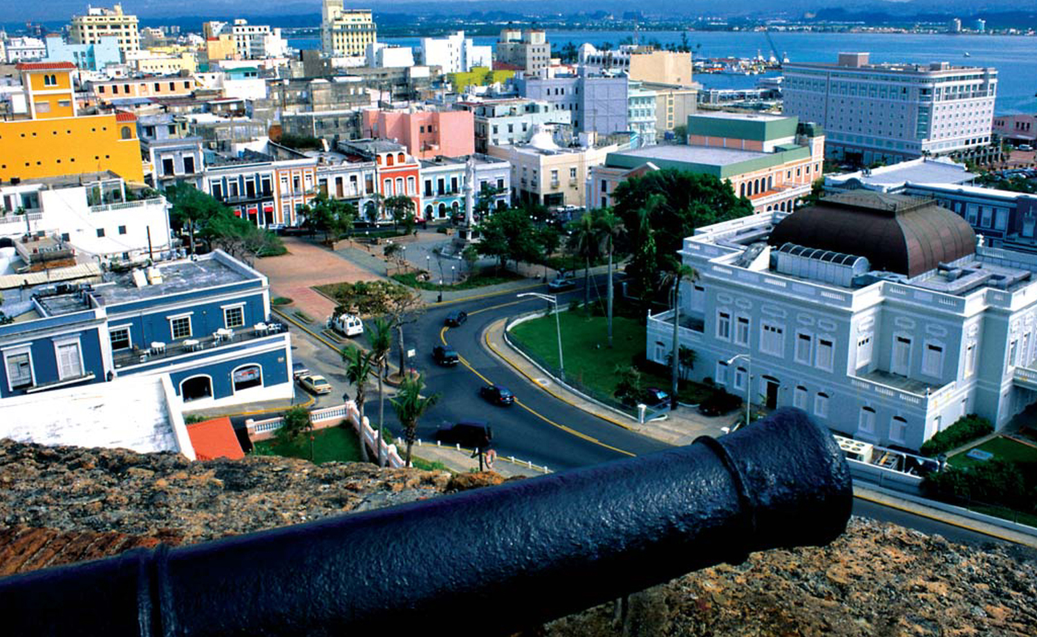 A cannon from the Spanish colonial era stands guard over modern San Juan So - photo 10