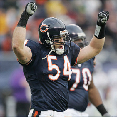 Superstar linebacker Brian Urlacher acknowledges the fans applause after making - photo 1