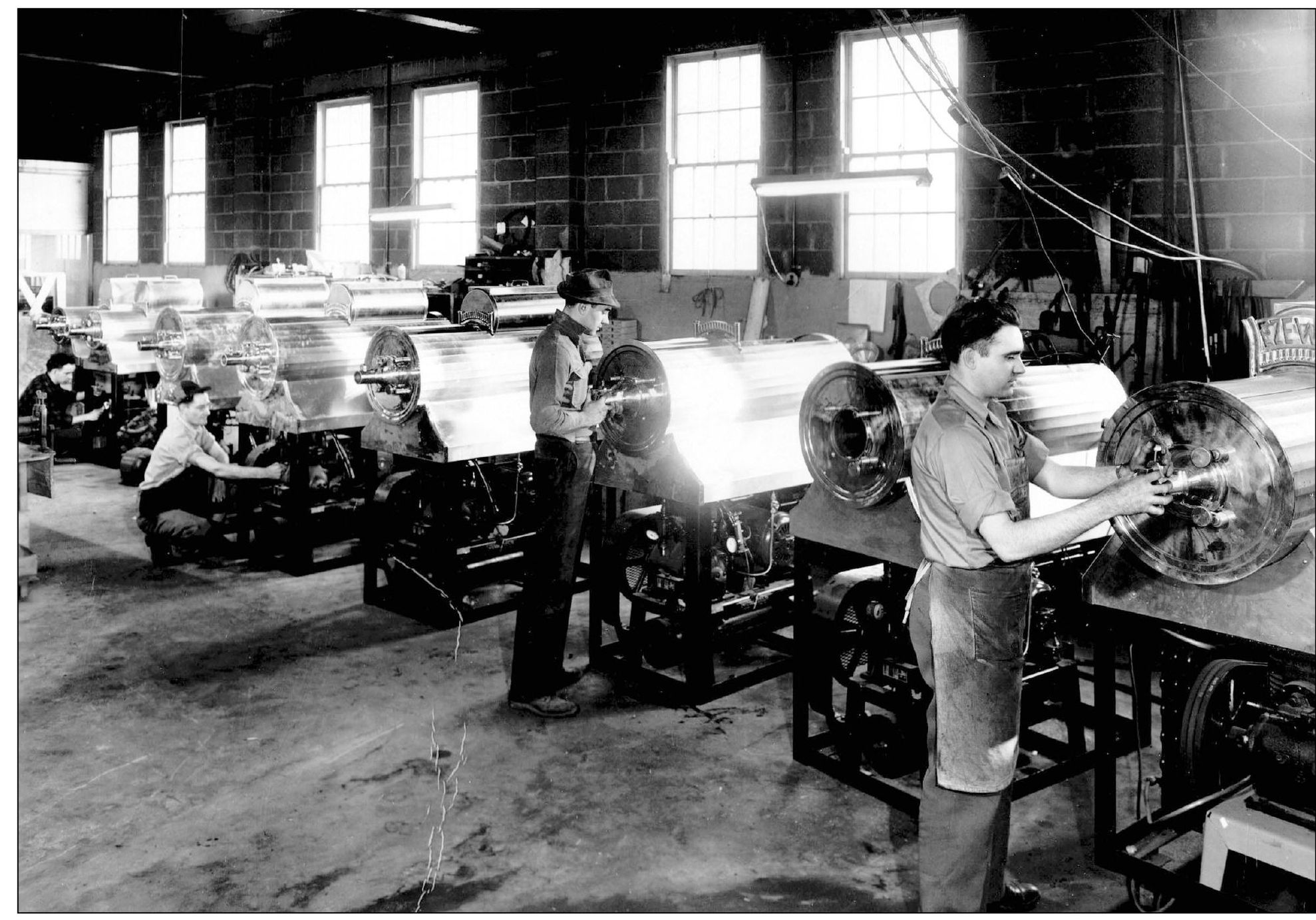 Frank P Thomas Jr center works on the production line at the General - photo 5