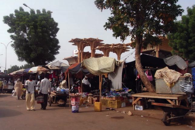 Merchants sell their wares at a market in Niamey Nigers surging population - photo 5