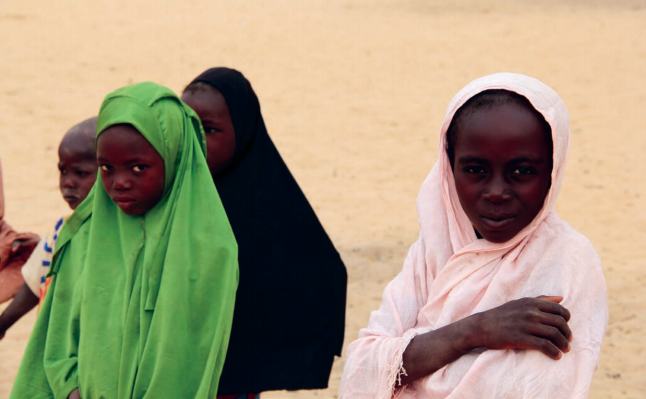 Young girls in Niamey wear traditional Islamic clothing That assessment is - photo 6
