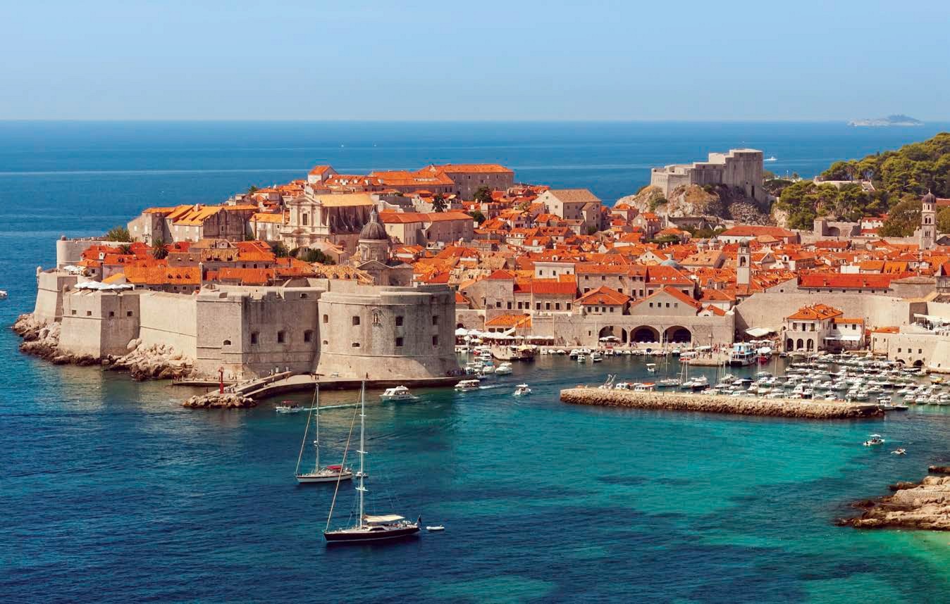 The turquoise waters of the Adriatic contrast with the red roofs and white - photo 5