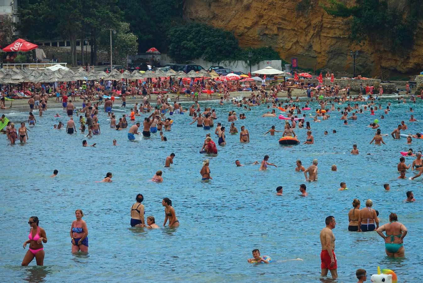 Crowds of tourists enjoy a beach in Dubrovnik Despite overcrowding in this - photo 6