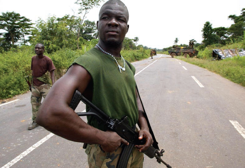 These soldiers stand guard in 2004 Armed men were a common sight in Cte - photo 4