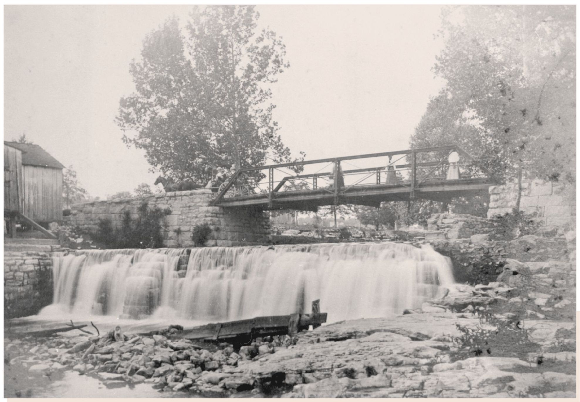 This image of a century ago calls ones attention to the iron bridge and dam - photo 3