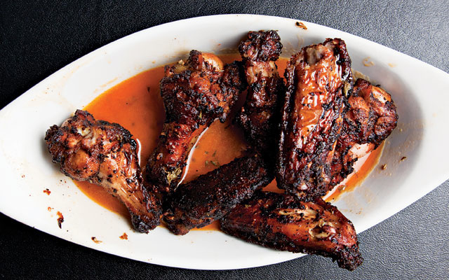 These wings are smothered in a spiced butter sauce that makes these wings even - photo 7