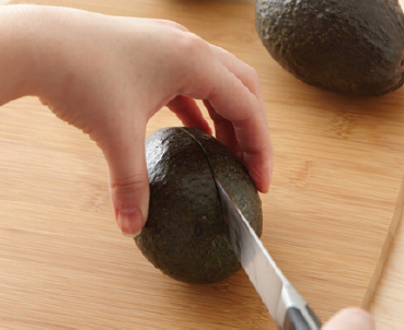 1 Cut avocado lengthwise through skin and around pit 2 With hands slowly - photo 1