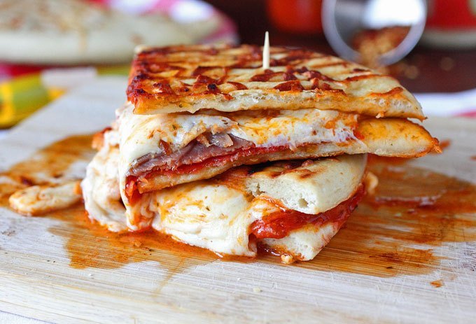 All of your favourite pizza ingredients melted together between a warm crispy - photo 9