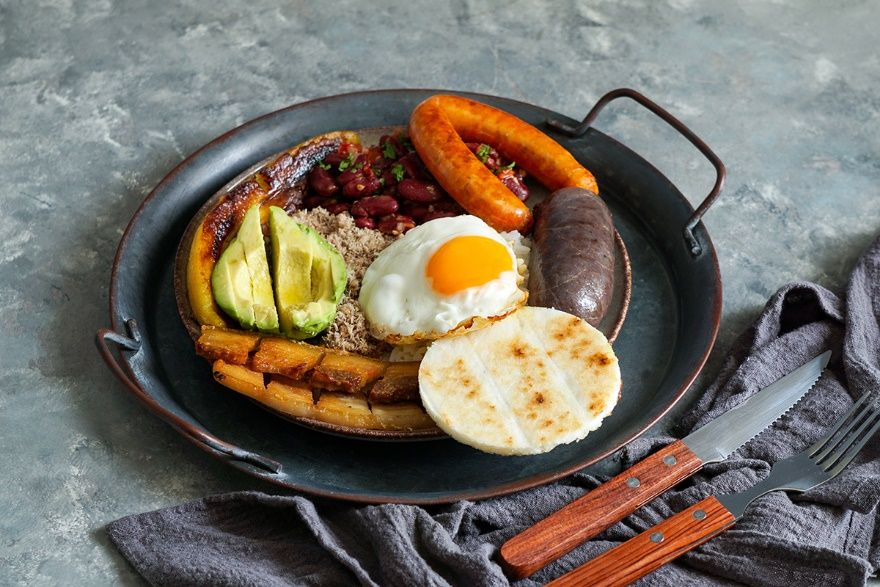 Bandeja Paisa is a staple in the Colombian cuisine It is made with beans - photo 5