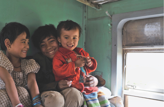 Children in a train compartment traveling back to Mandalay from a festival in - photo 2