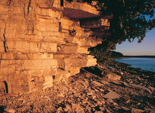 Sunset illuminates the limestone rock formations along Big Bay de Noc in - photo 9