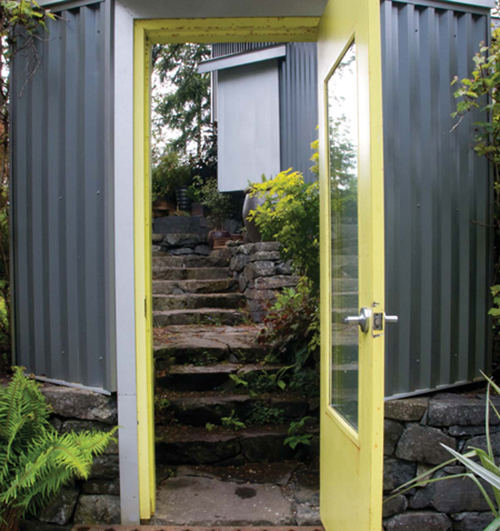 A street side freestanding doorway with a salvaged industrial metal entry floor - photo 6