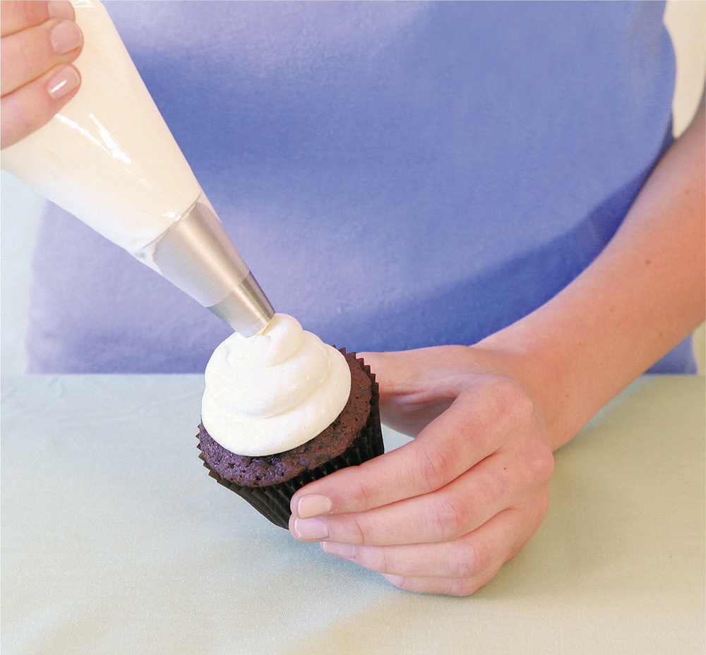 Filling a Pastry Bag Make a C with your hand Fold the pastry bag edges over - photo 10