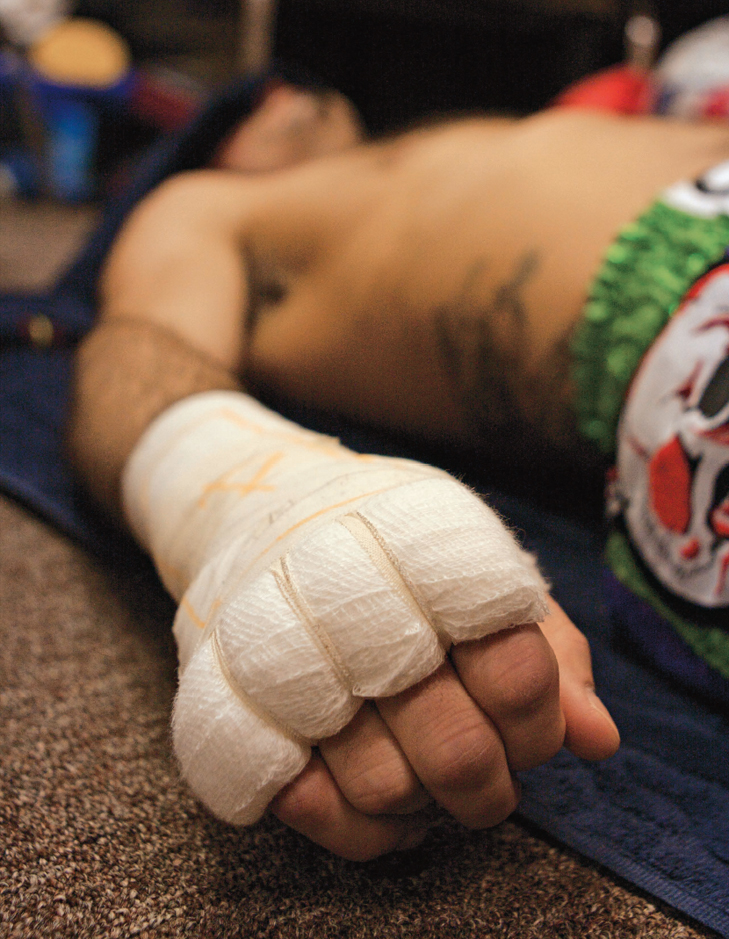 A fighter mentally prepares for battle at Lumpinee Stadium in Bangkok - photo 5