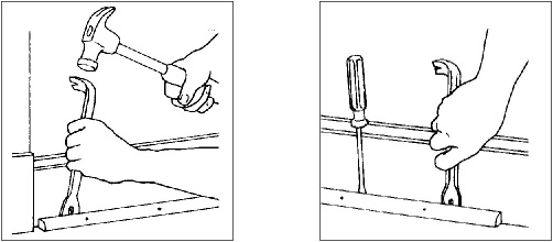 Use a prybar to remove shoe molding A screwdriver holds the loosened piece - photo 2