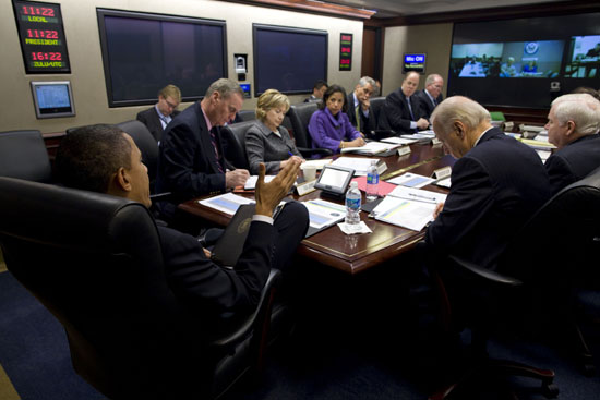 President Barack Obama and senior staff attend a briefing in the White House - photo 12